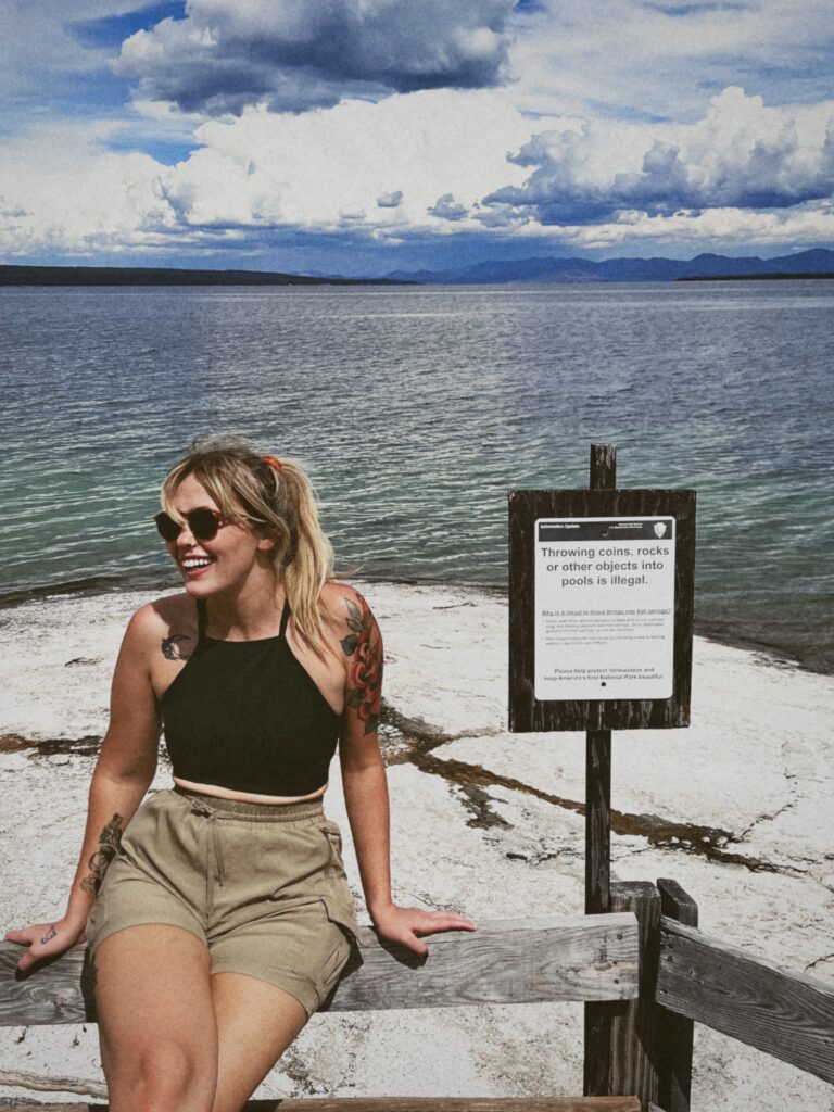 Girl admiring the scenic view of Yellowstone Lake in Yellowstone National Park.