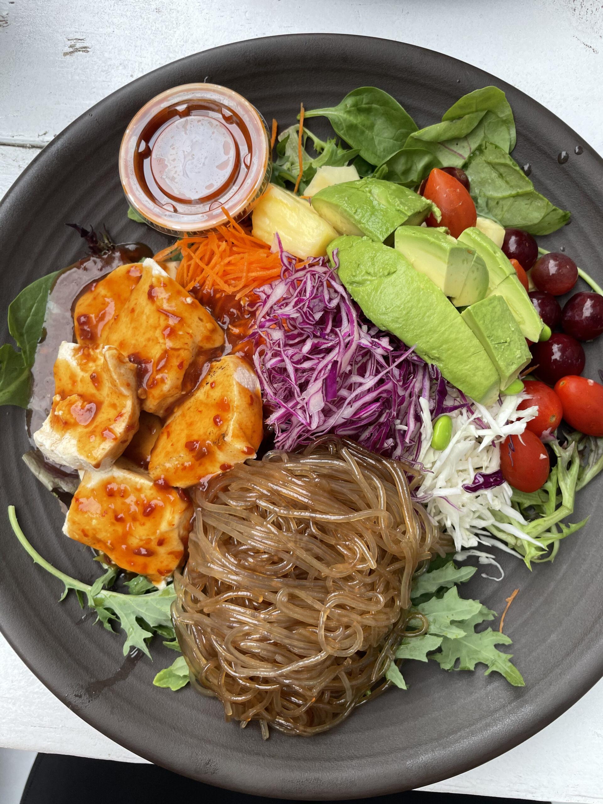 Image of Nancy's Sky Garden Spicy Tuna Rainbow Bowl, a healthy food option in Austin. The bowl is filled with fresh vegetables, sweet potato noodles and spicy tuna, making it a perfect meal for those looking for a nutritious and delicious meal in Austin.